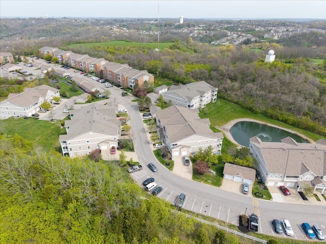 birds eye view of property featuring a water view and a residential view
