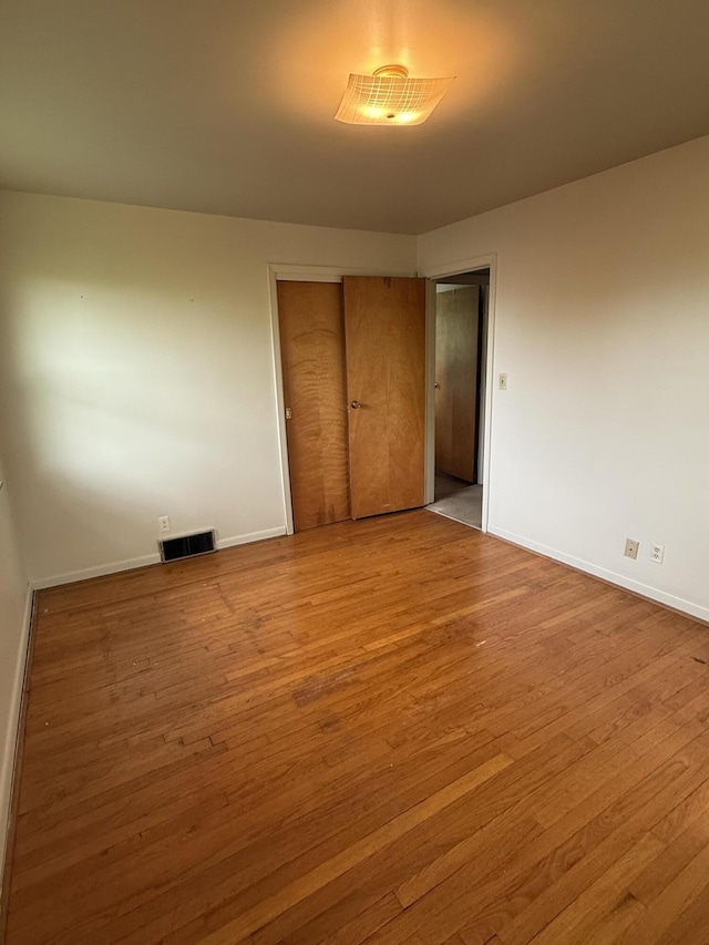 143 Capri Dr, Fort Thomas, KY 41075 - unfurnished bedroom featuring wood finished floors, baseboards, and a closet
