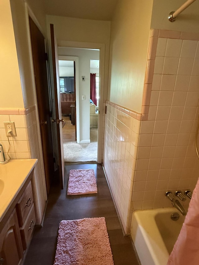 143 Capri Dr, Fort Thomas, KY 41075 - full bathroom with tile walls, vanity, tub / shower combination, and a wainscoted wall