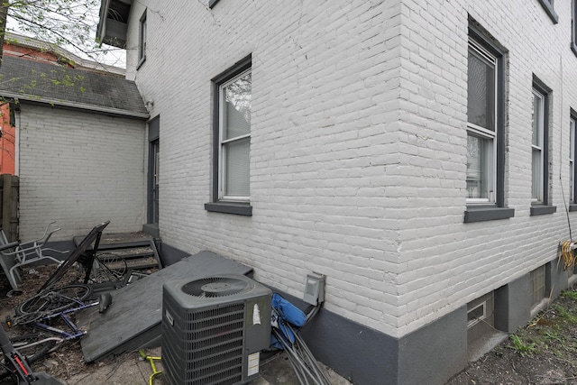 1706 Eastern Ave, Covington, KY 41014 - view of home's exterior with central AC unit and brick siding