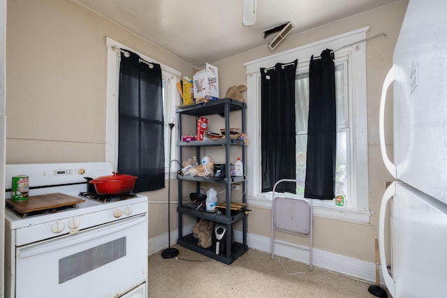1706 Eastern Ave, Covington, KY 41014 - kitchen with white appliances and baseboards