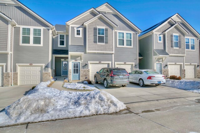 714 Streamside Dr Unit L, Alexandria, KY 41001 - multi unit property featuring board and batten siding, driveway, a garage, and stone siding