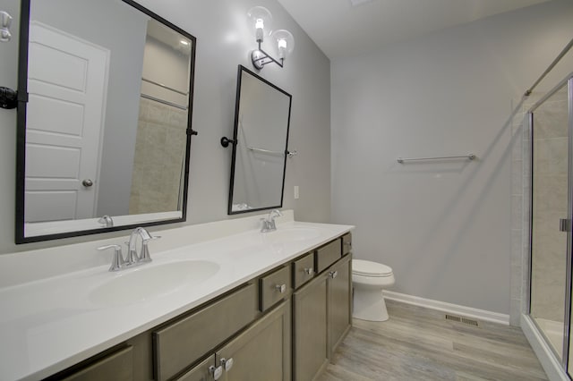 714 Streamside Dr Unit L, Alexandria, KY 41001 - full bath featuring a sink, toilet, a tile shower, and wood finished floors