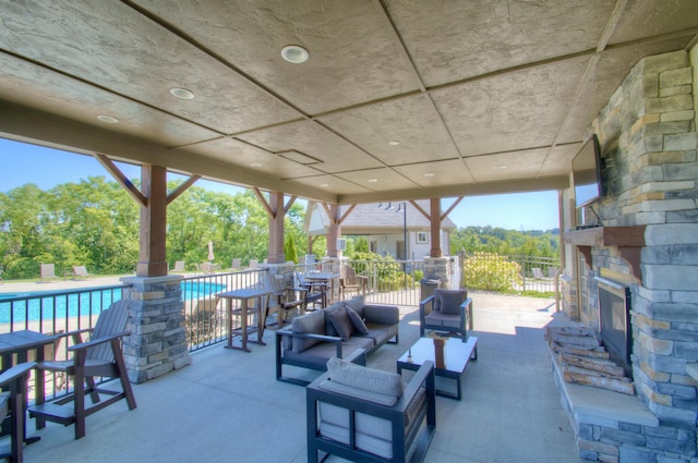 714 Streamside Dr Unit L, Alexandria, KY 41001 - view of patio featuring a fenced in pool and an outdoor living space with a fireplace