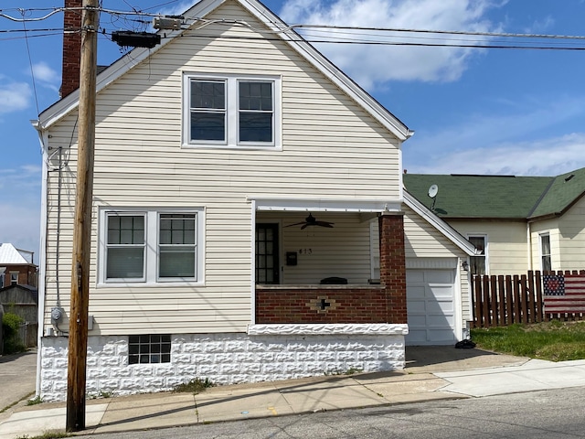 view of front of house with brick siding, ceiling fan, a garage, fence, and covered porch