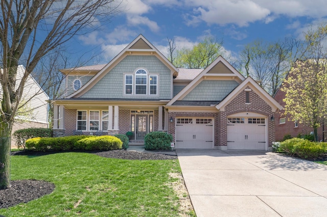 craftsman inspired home with brick siding, a front lawn, an attached garage, and concrete driveway