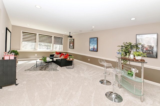 living room featuring baseboards, carpet, and recessed lighting