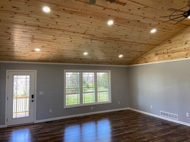 unfurnished room with crown molding, wooden ceiling, wood finished floors, and visible vents