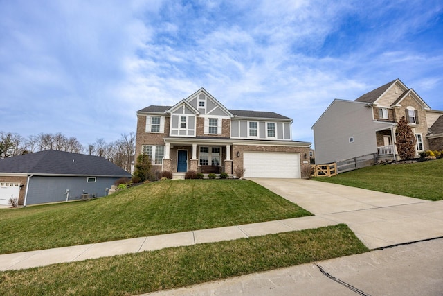 view of front of property with concrete driveway, a garage, fence, and a front lawn