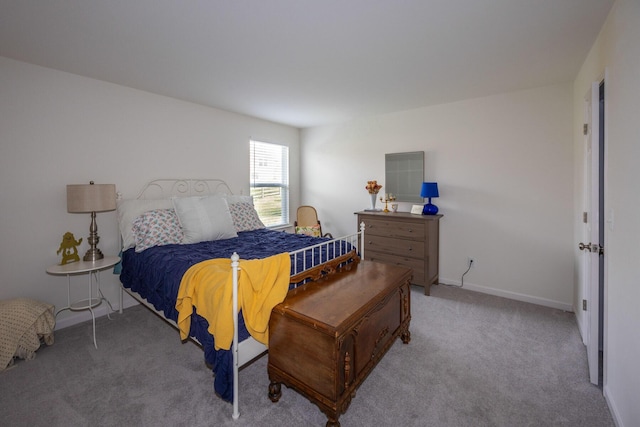 carpeted bedroom with baseboards