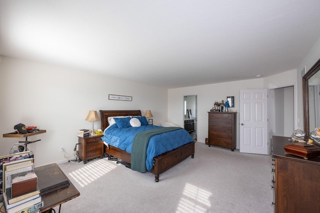bedroom featuring carpet flooring and ensuite bathroom