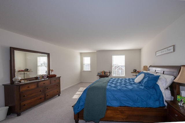 bedroom featuring light colored carpet