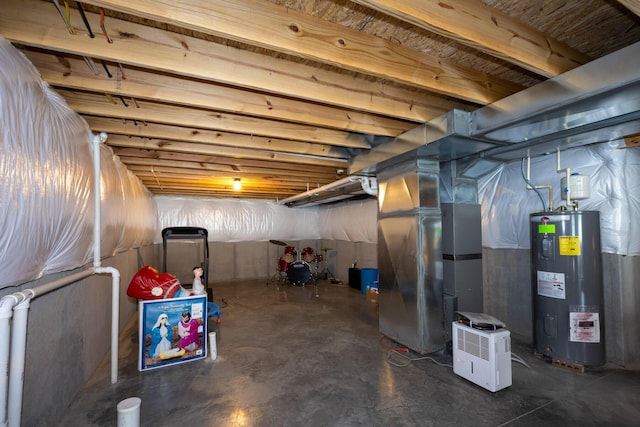 unfinished below grade area featuring water heater and heating unit