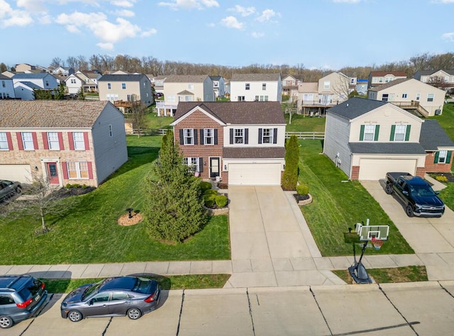 birds eye view of property with a residential view