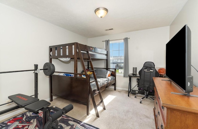 bedroom with visible vents, baseboards, and carpet floors