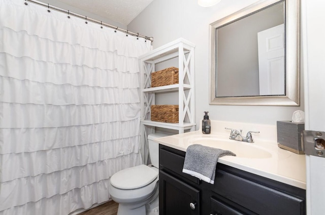 full bathroom featuring curtained shower, vanity, toilet, and wood finished floors