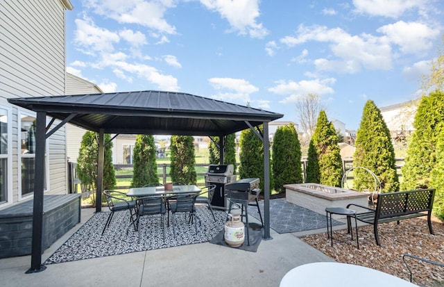 view of patio / terrace featuring a gazebo, outdoor dining area, and area for grilling