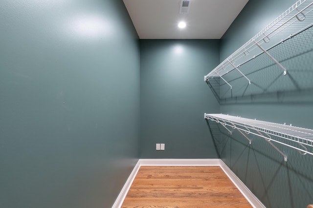 224 Wallace Ave, Covington, KY 41014 - walk in closet with visible vents and light wood finished floors