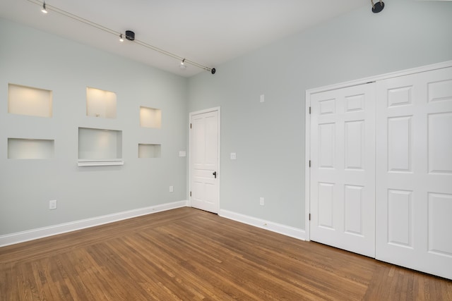 224 Wallace Ave, Covington, KY 41014 - unfurnished bedroom featuring wood finished floors, a closet, and baseboards