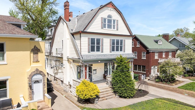 224 Wallace Ave, Covington, KY 41014 - view of front of home featuring a chimney, entry steps, and a gambrel roof