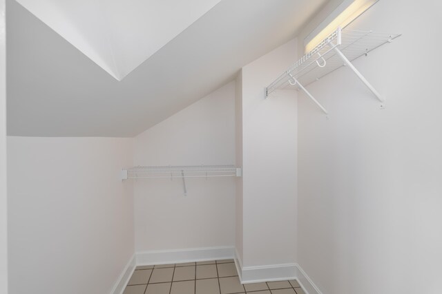 224 Wallace Ave, Covington, KY 41014 - walk in closet featuring light tile patterned floors and lofted ceiling
