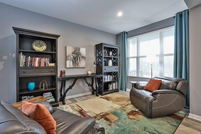 sitting room with wood finished floors, baseboards, and recessed lighting