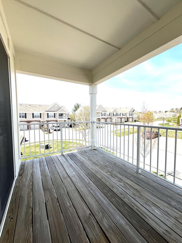 wooden terrace with a residential view