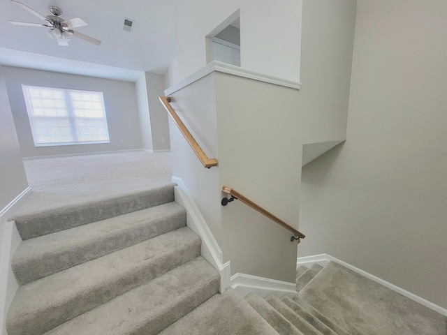 staircase with carpet, visible vents, and baseboards