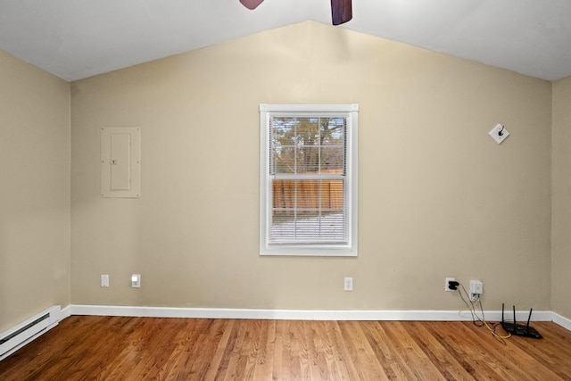 empty room featuring a ceiling fan, vaulted ceiling, wood finished floors, a baseboard radiator, and baseboards