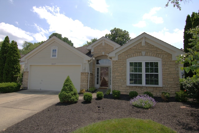 2647 Saint Charles Cir, Union, KY 41091 - view of front of house featuring stone siding, driveway, and a garage