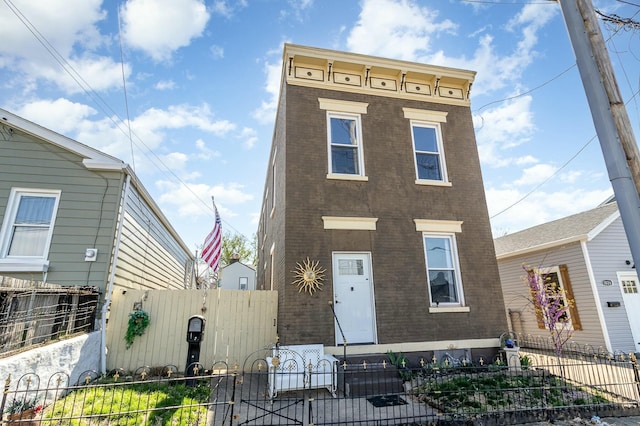 1028 Orchard St, Newport, KY 41071 - view of front facade featuring brick siding and a fenced front yard