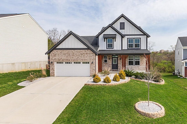 9956 Meadow Glen Dr, Independence, KY 41051 - view of front of home featuring board and batten siding, a front lawn, brick siding, an attached garage, and concrete driveway