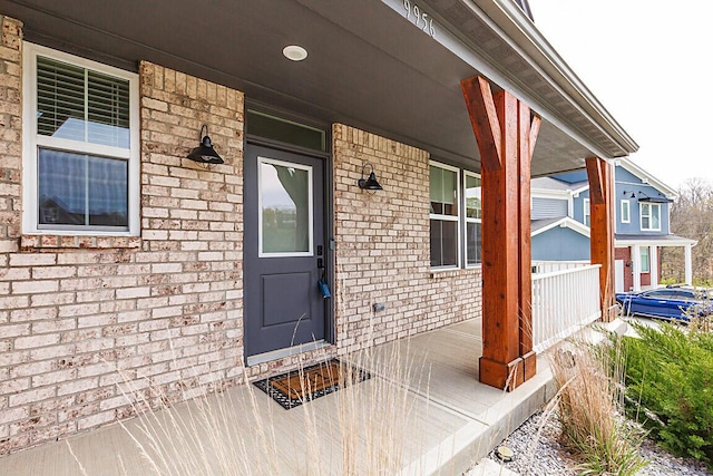9956 Meadow Glen Dr, Independence, KY 41051 - doorway to property featuring a porch and brick siding