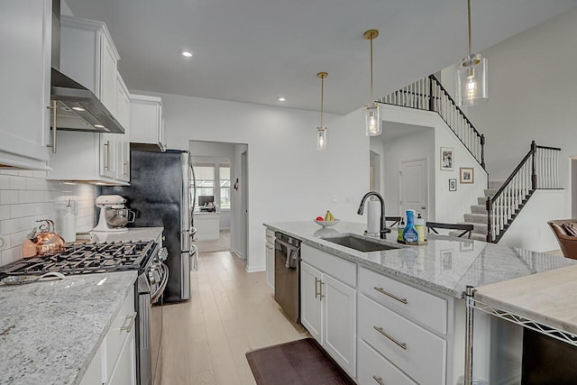 9956 Meadow Glen Dr, Independence, KY 41051 - kitchen featuring hanging light fixtures, stainless steel range with gas stovetop, dishwasher, white cabinetry, and decorative backsplash
