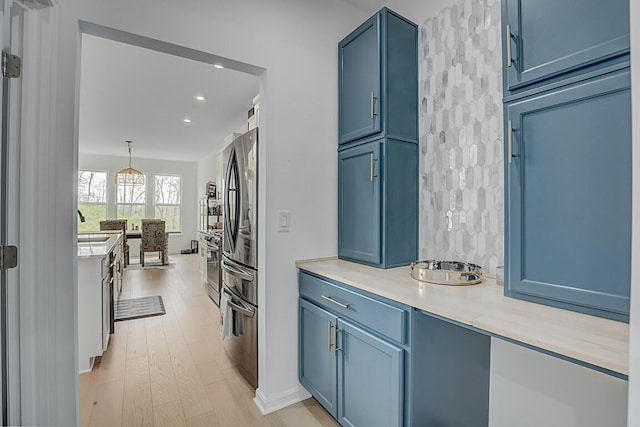 9956 Meadow Glen Dr, Independence, KY 41051 - kitchen featuring blue cabinets, light countertops, and stainless steel appliances