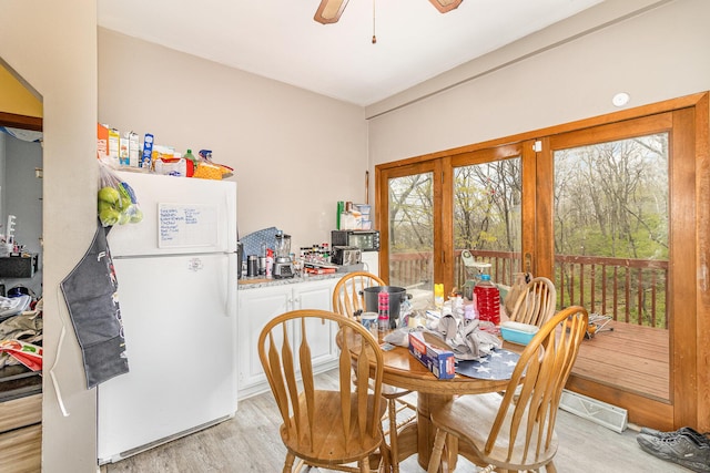 25 High St, Newport, KY 41071 - dining space with a ceiling fan, light wood-style floors, and a healthy amount of sunlight