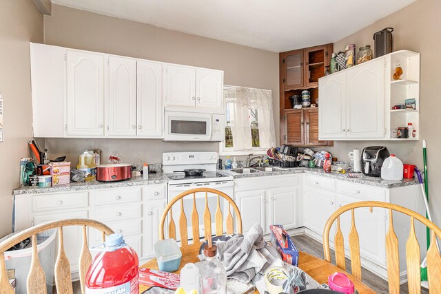 25 High St, Newport, KY 41071 - kitchen with white appliances, light countertops, white cabinetry, open shelves, and a sink