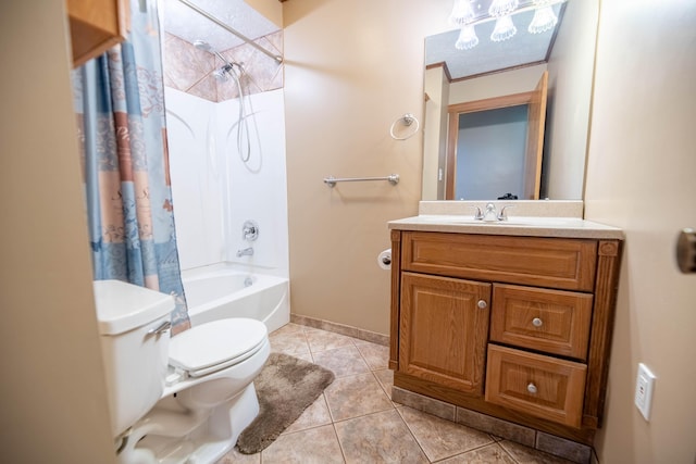 full bathroom featuring shower / bath combo with shower curtain, tile patterned flooring, vanity, toilet, and baseboards