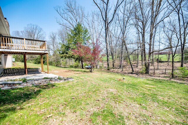 view of yard with a wooden deck