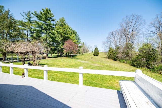 view of home's community with a yard and a deck