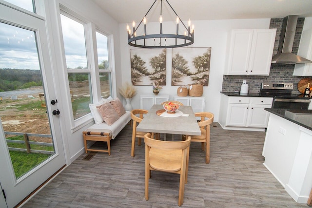 dining space with a chandelier and light wood finished floors