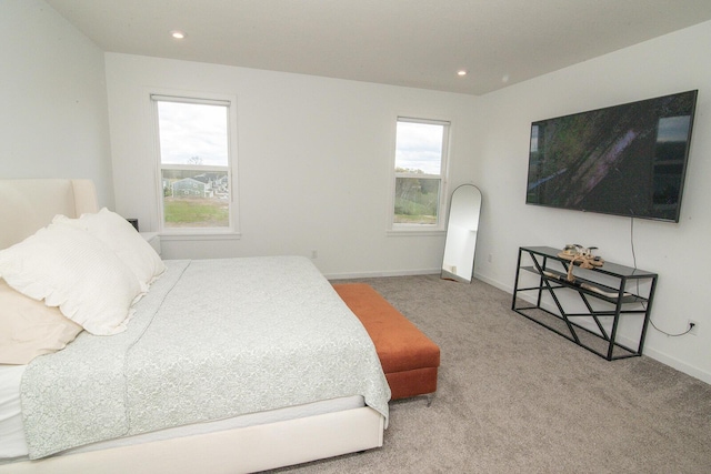 bedroom featuring recessed lighting, baseboards, multiple windows, and carpet floors