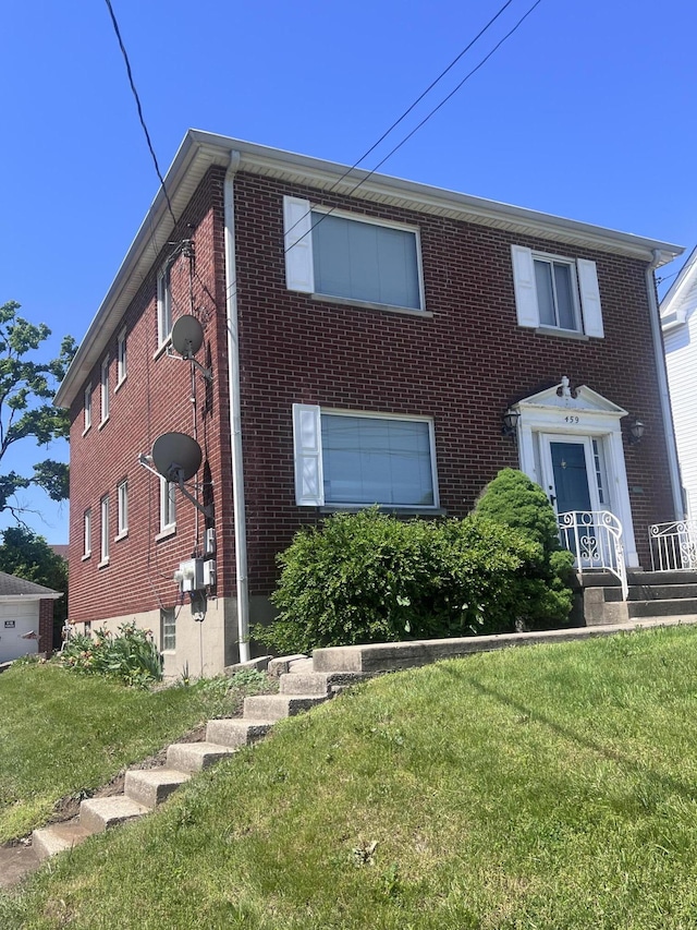 459 Commonwealth Ave, Erlanger, KY 41018 - view of front facade with a front yard and brick siding