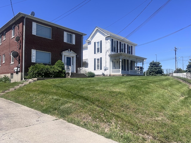 459 Commonwealth Ave, Erlanger, KY 41018 - colonial house with a front lawn and brick siding
