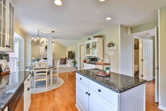 11506 Sutherland Dr, Walton, KY 41094 - kitchen with light wood finished floors, white cabinets, an inviting chandelier, glass insert cabinets, and dishwasher