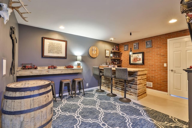 11506 Sutherland Dr, Walton, KY 41094 - bar with bar area, baseboards, recessed lighting, an accent wall, and brick wall