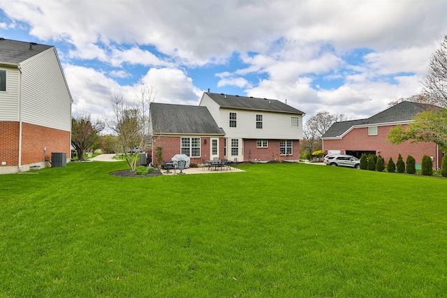 11506 Sutherland Dr, Walton, KY 41094 - rear view of house with brick siding, a yard, a patio, and central AC unit