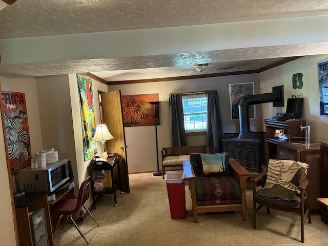 carpeted living area featuring a wood stove and a textured ceiling