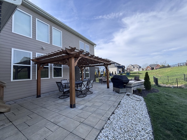 view of patio with fence, a pergola, and a grill