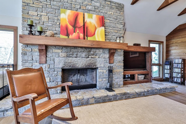 445 Elk Lake Resort Rd Unit 947-948, Owenton, KY 40359 - living area featuring lofted ceiling, wood finished floors, a stone fireplace, and wooden walls